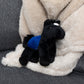 Small Beau Horse horse stuffed animal wearing a royal blue branded mane 'n tail saddle. Standing on the blanket