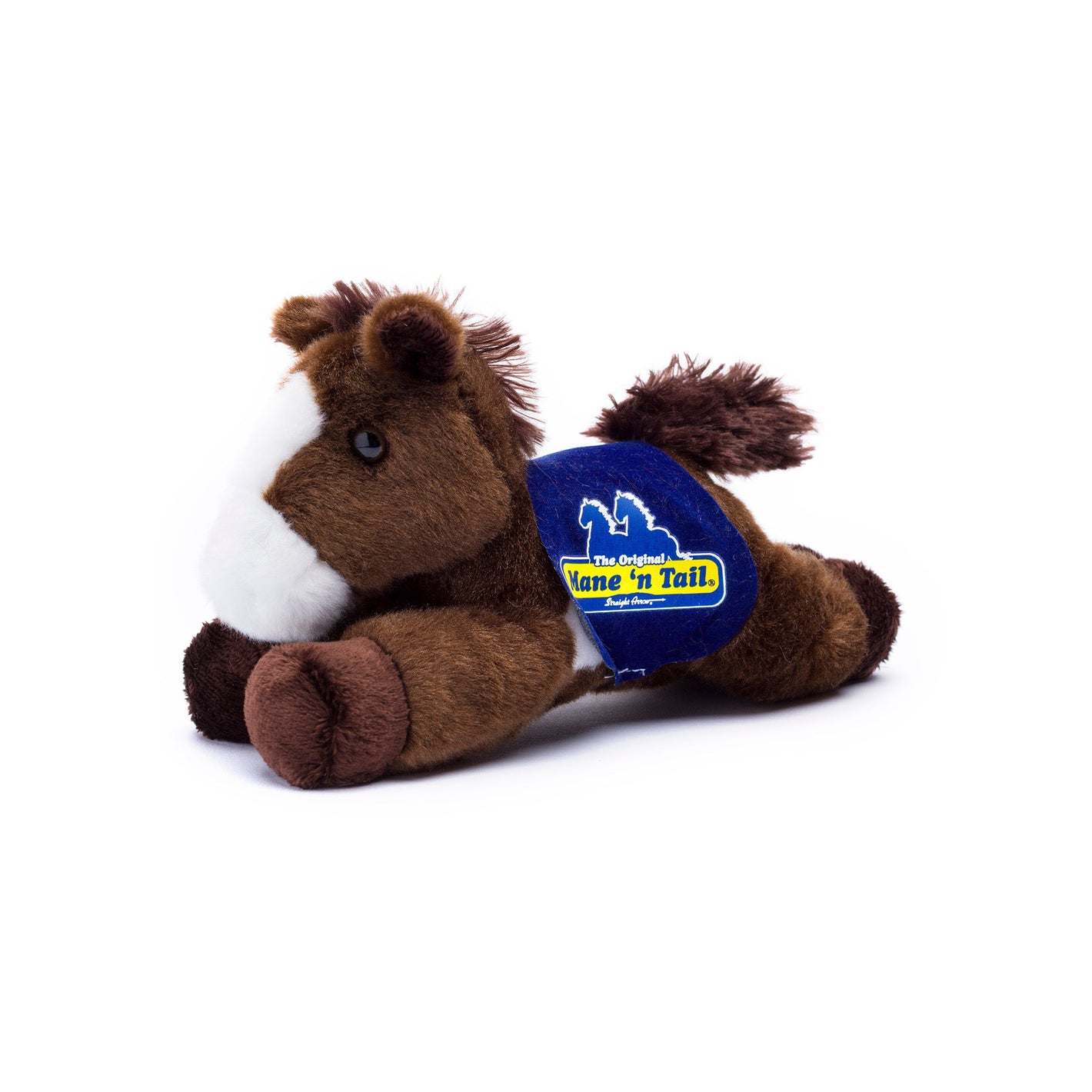 Small Paint horse stuffed animal wearing a royal blue branded mane 'n tail saddle. Standing in the white background