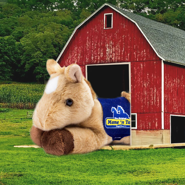A photoshopped photo of a Prancer Horse placed inside of a red barn